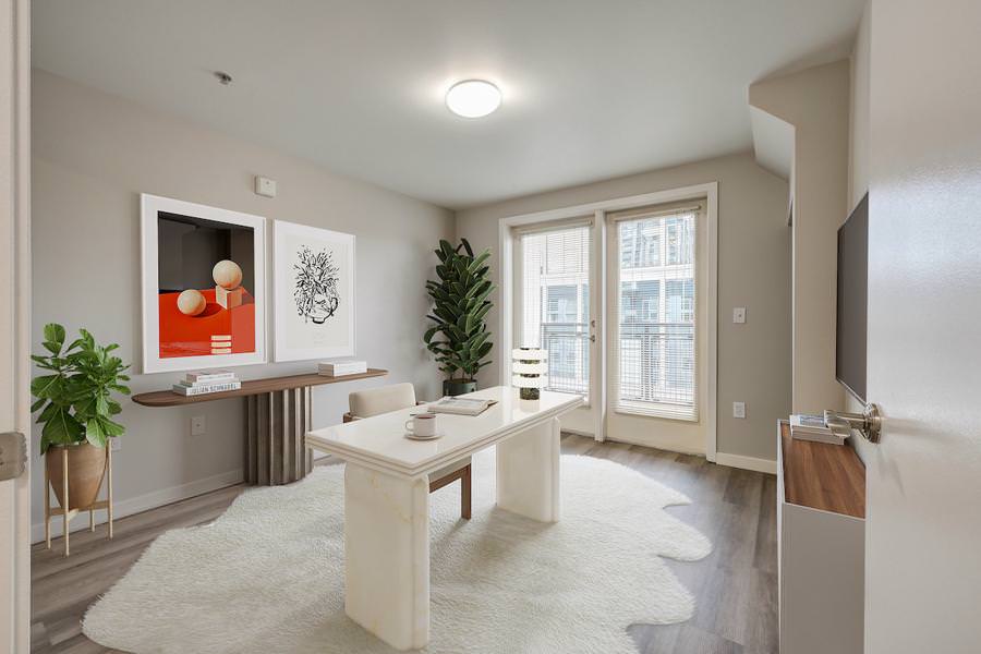 Contemporary apartment office virtually staged with a marble desk, stylish artwork, and layered textures for a cozy work-from-home setup.