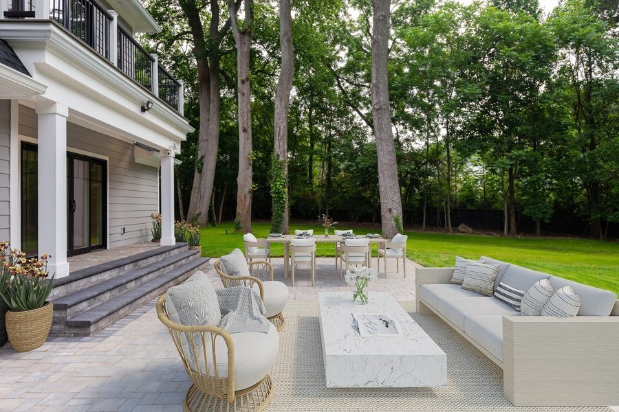Backyard virtually staged with dining table, cushioned seating, and fire pit
