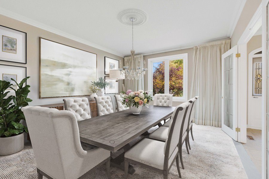 Classic dining room design with tufted high-back chairs, a wooden table, and a floral centerpiece under a chandelier.