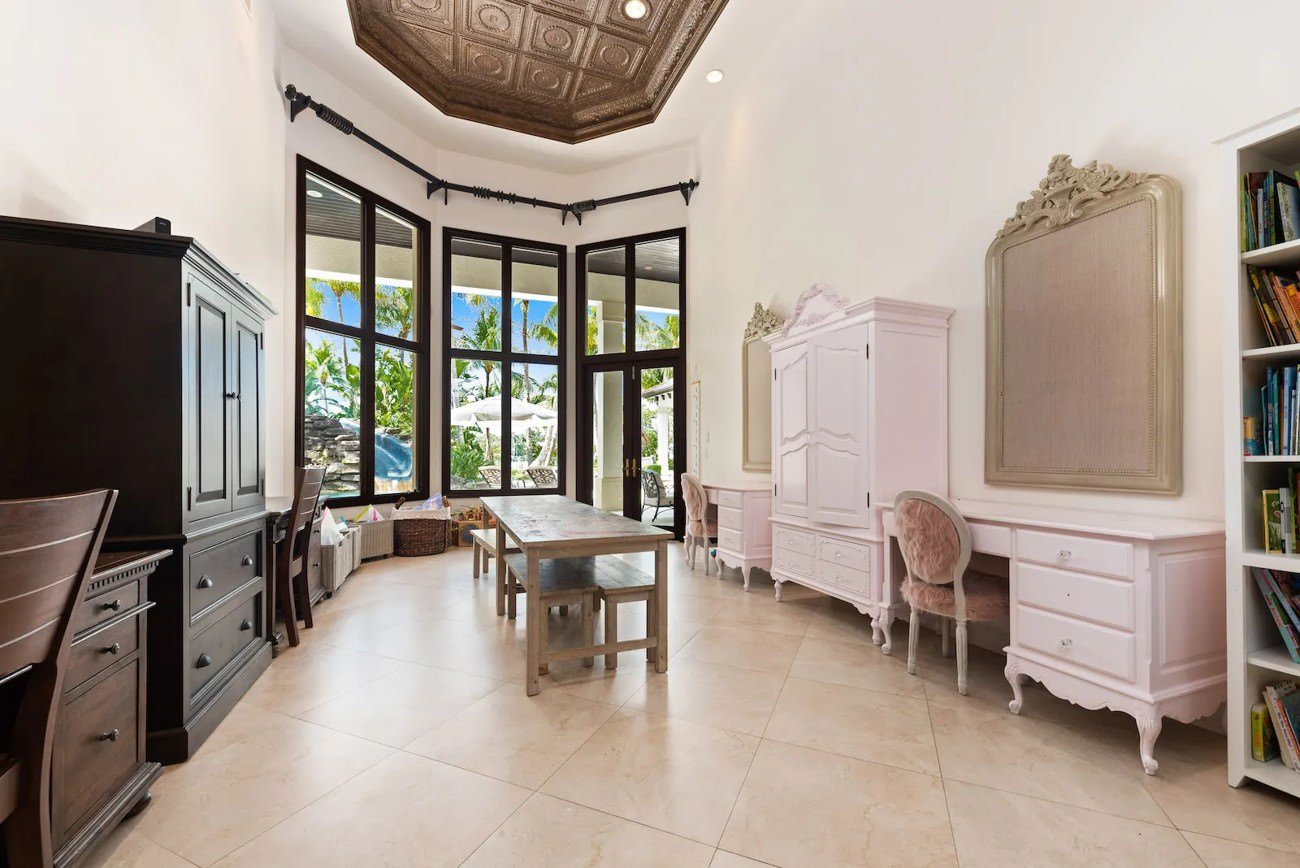 Alt Text: Traditional home office with dark wood furniture and ornate decor prior to digital renovation.