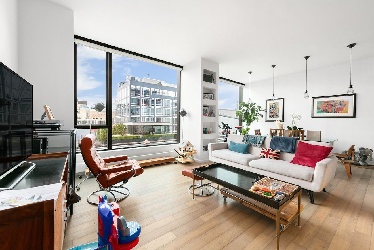 Unfurnished downtown new york apartment with wide plank floors and large corner windows, ideal for digital staging