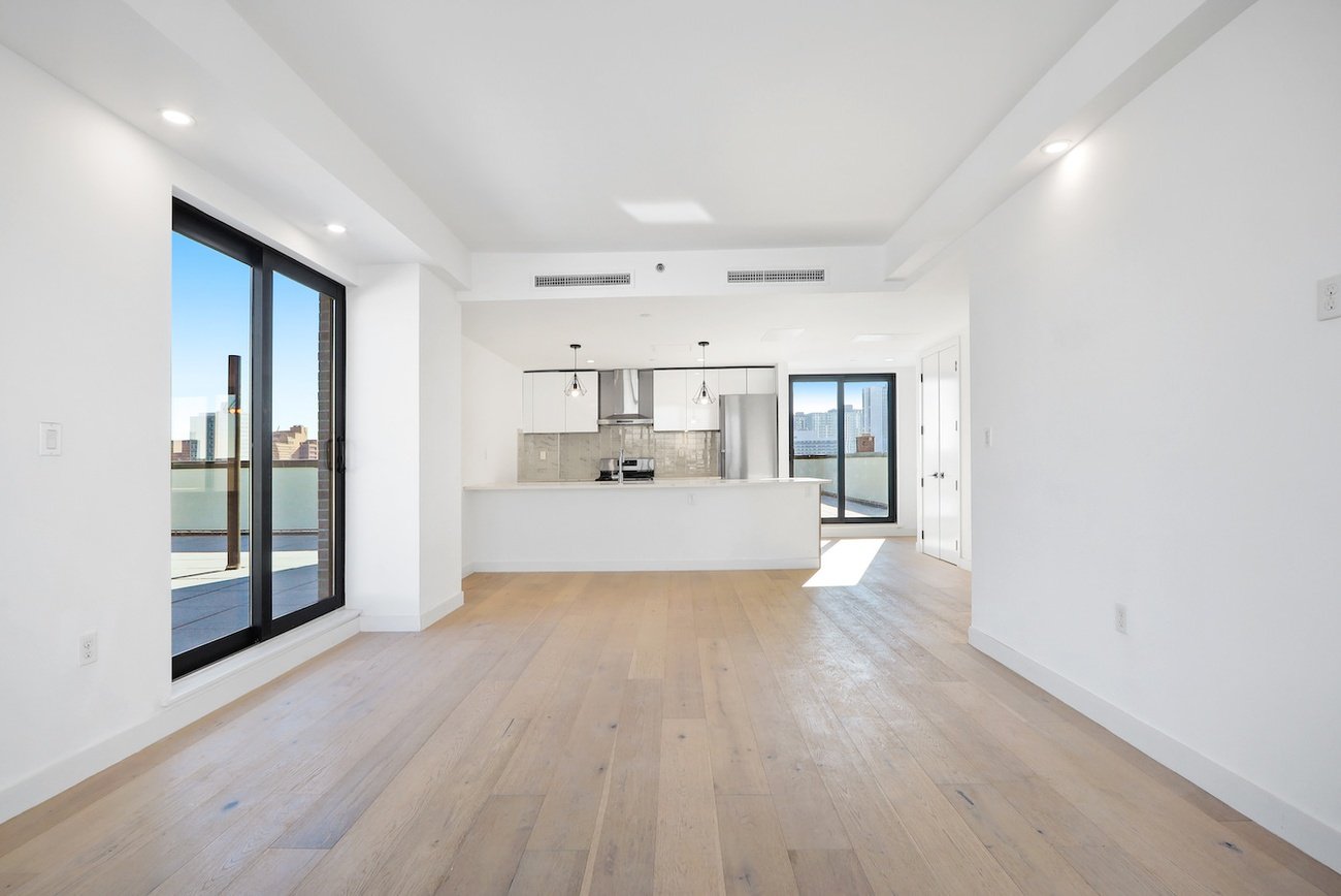 Bright open layout with kitchen and balcony access