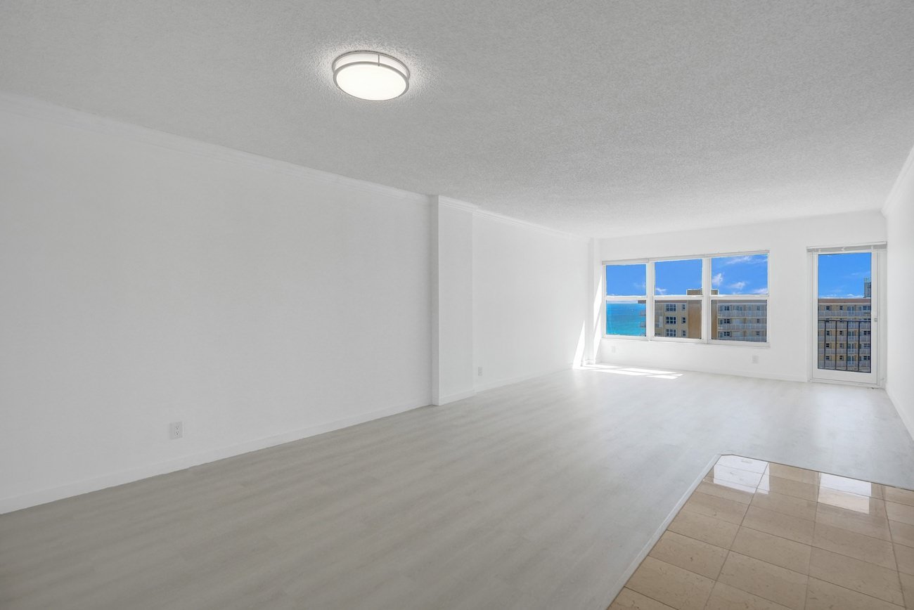 Spacious living and dining room with ocean view windows