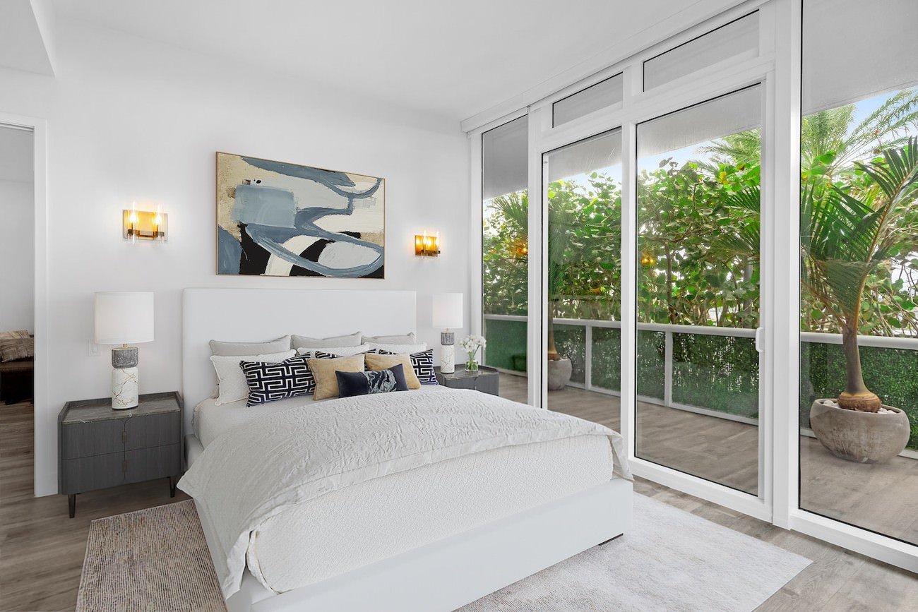 minimalist bedroom digitally transformed with transitional style furniture replacement and staging.