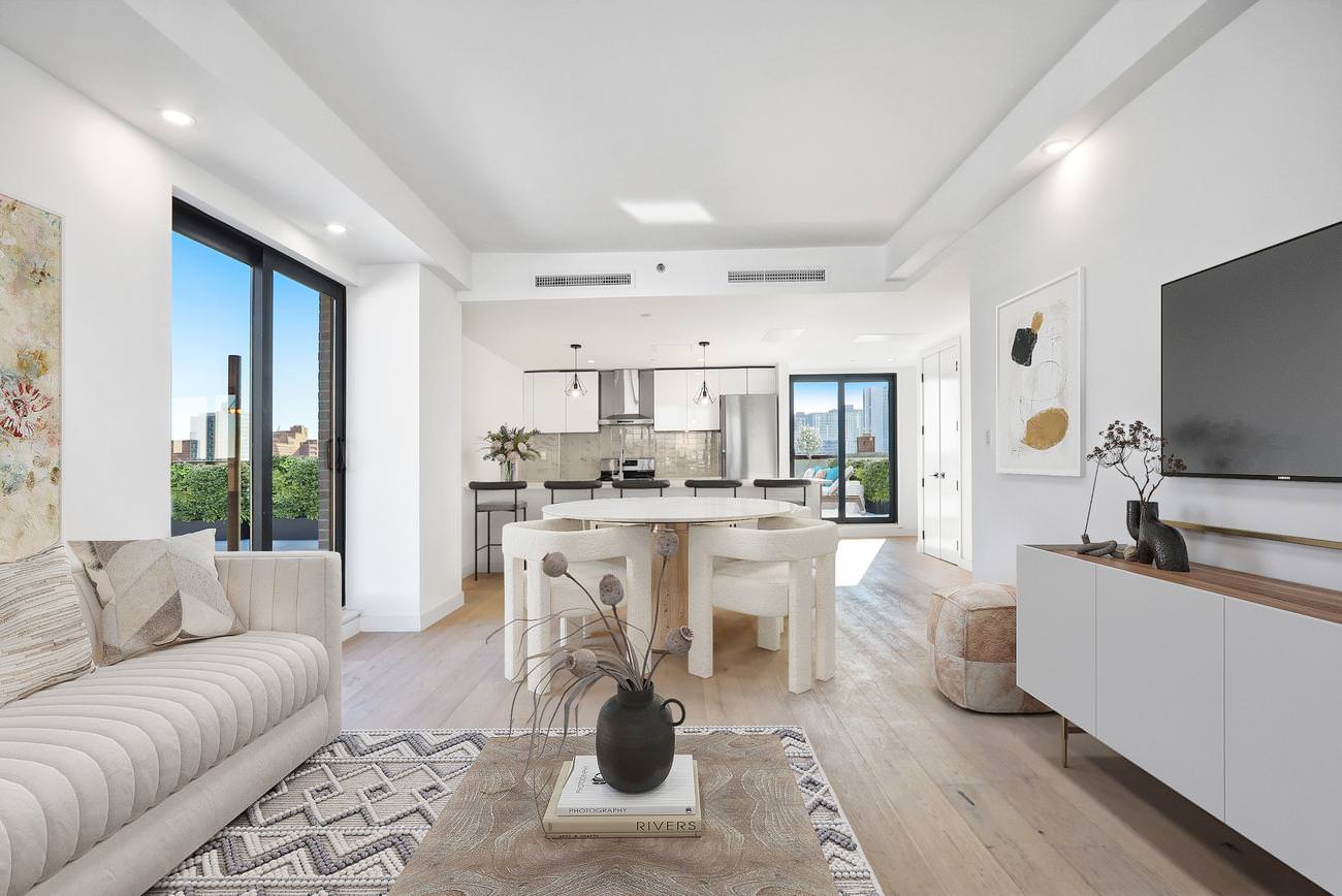 Contemporary high-rise living room with floor-to-ceiling windows and modern white furnishings
