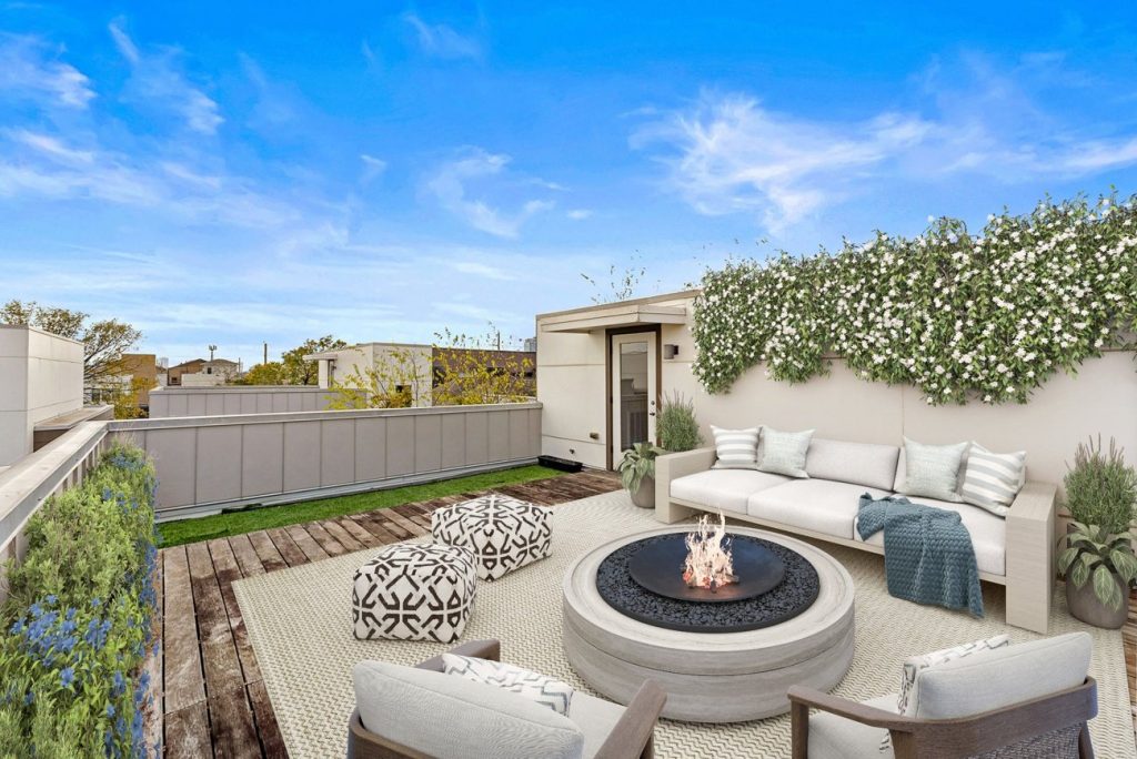 Digitally staged rooftop deck with firepit, outdoor seating, and privacy greenery