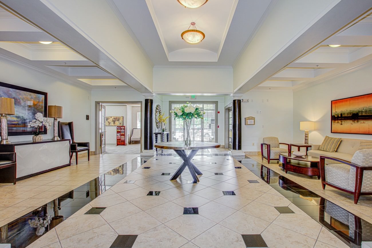 Senior living lobby with dated seating and neutral decor before digital furniture enhancements.