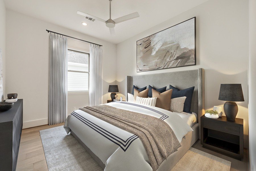 virtual staging of a bedroom with a sophisticated color palette and abstract wall art in texas