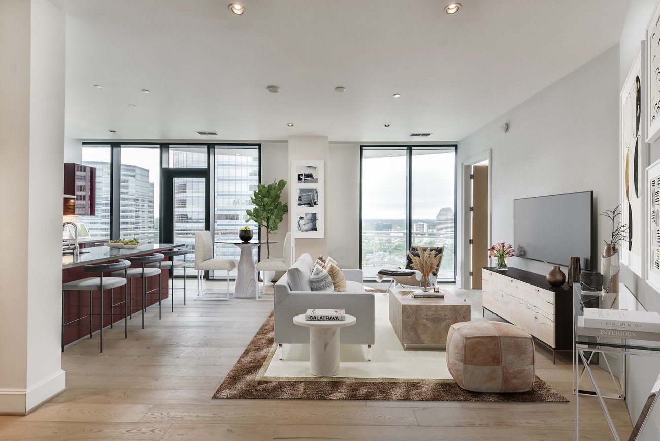 Open-plan living area virtually staged with stylish modern furniture and decor