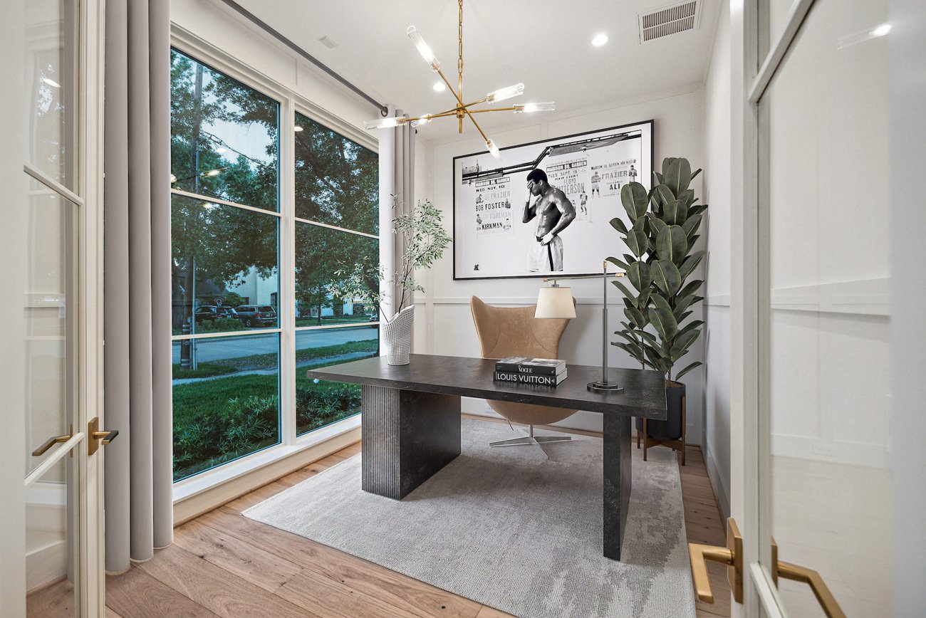 Virtually staged office with light wood flooring and egg desk chair
